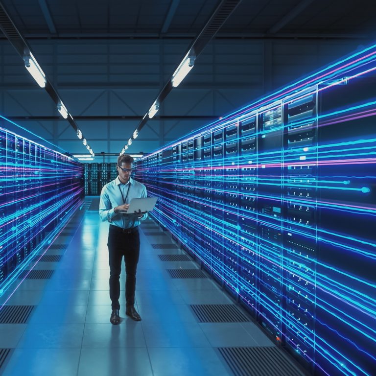 Futuristic,Concept:,Data,Center,Chief,Technology,Officer,Holding,Laptop,,Standing